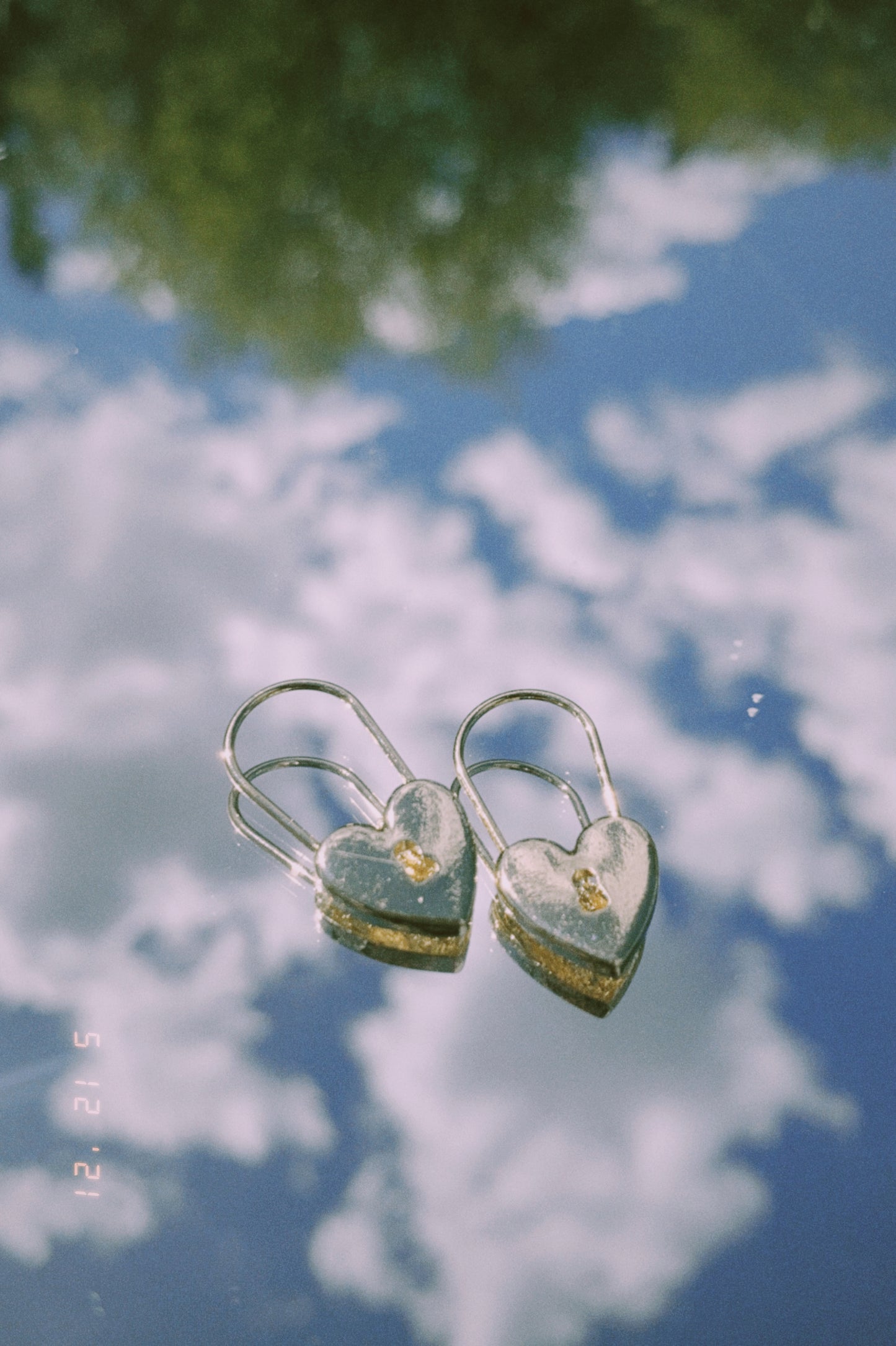 locked in love earrings